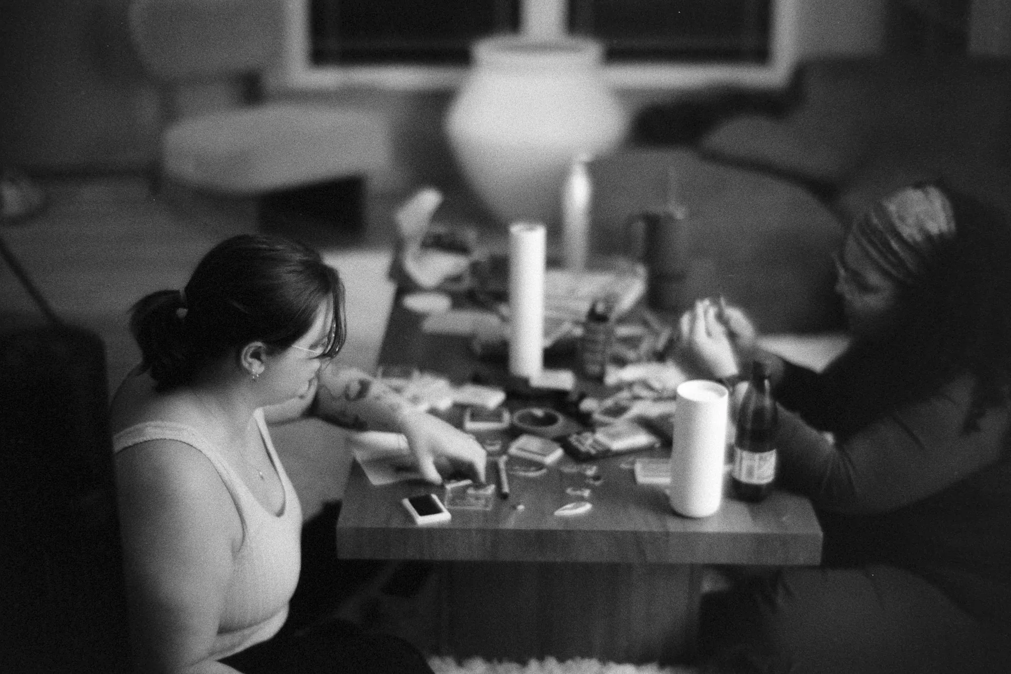 Two people playing a game at a coffee table