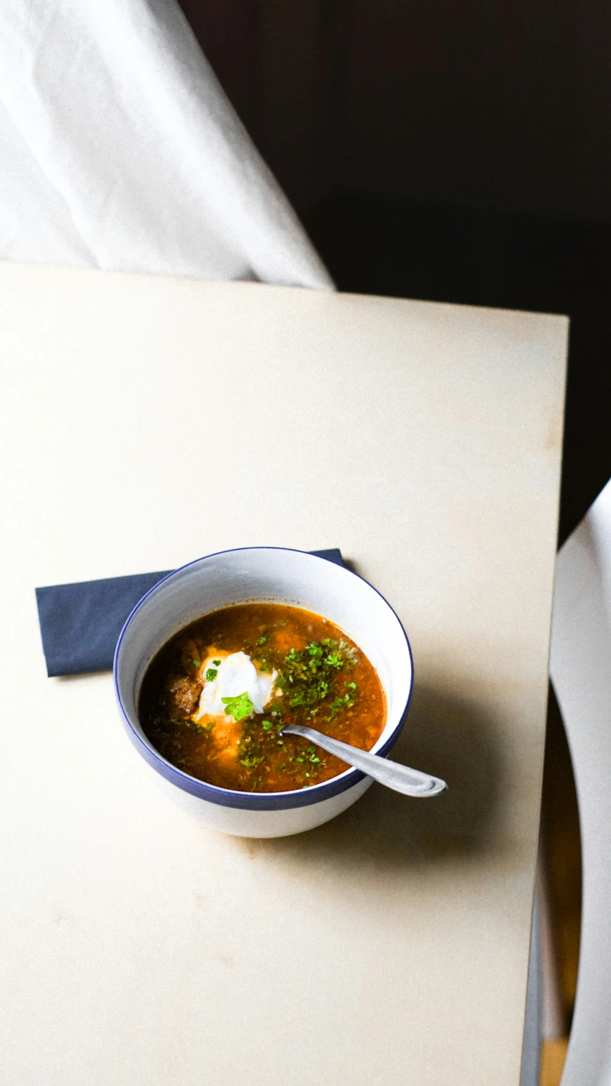 A bowl of soup set out on a table