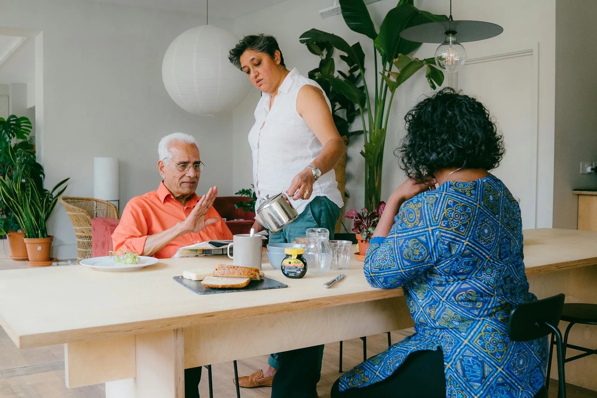 People sitting around a table eating together
