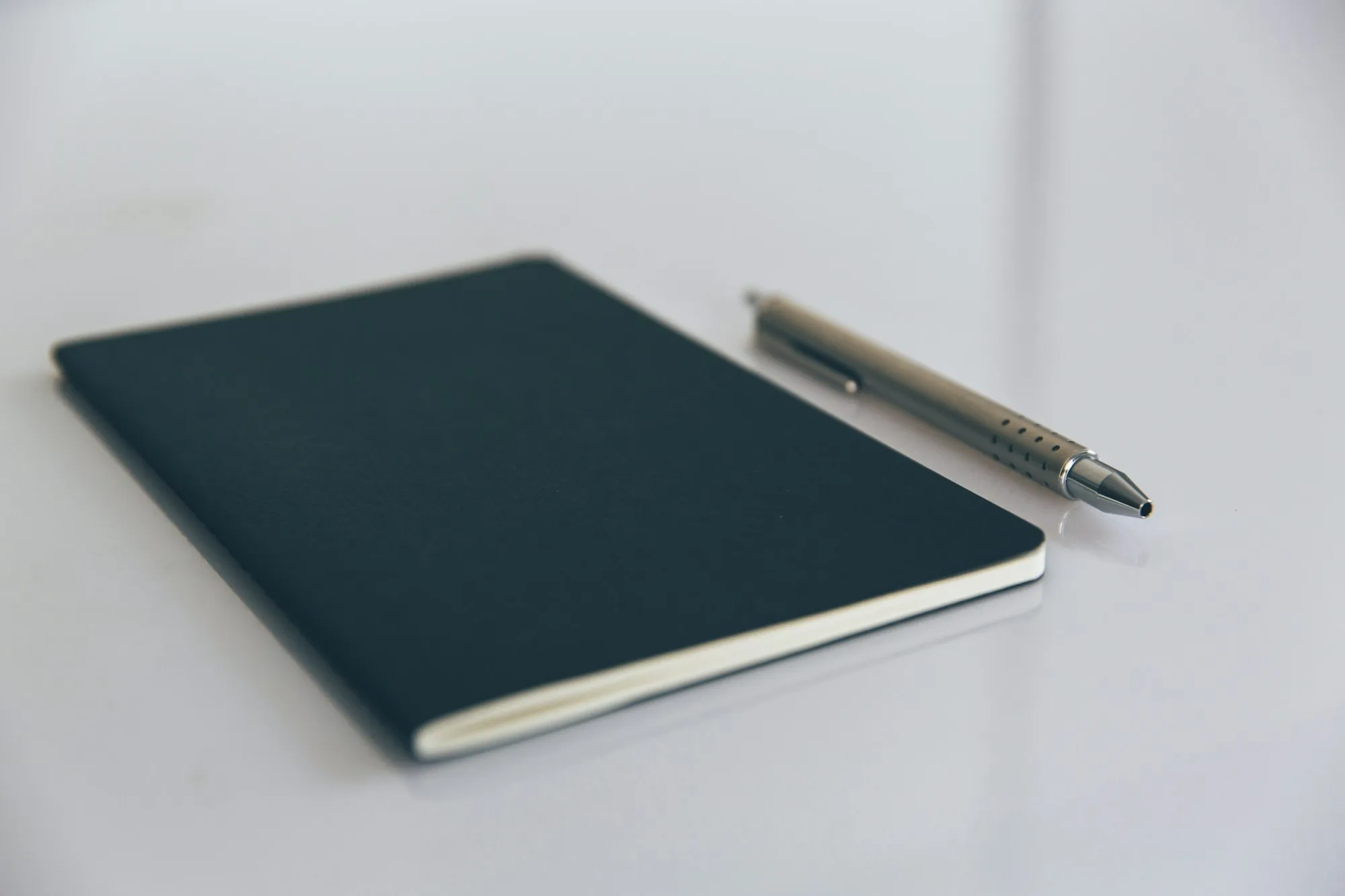 A book and a pen on a desk